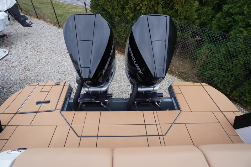 Slide: The Image of 2020 Aviara AV32 OB boat with dual Mercury outboard engines on a tan deck. - 74