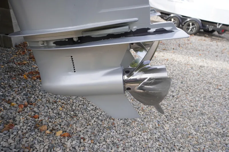 Slide: The Image of Close-up of 2020 Aviara AV32 OB boat propeller on gravel surface. - 78