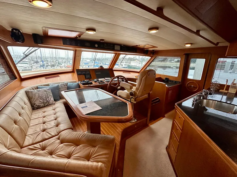Slide: The Image of Luxurious interior of 2005 Marlow Explorer 78 yacht with plush seating and helm station. - 12