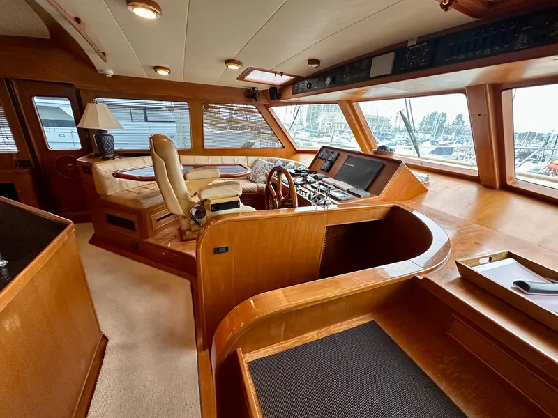 Slide: The Image of Luxurious interior of 2005 Marlow Explorer 78 yacht with helm station and seating area. - 13