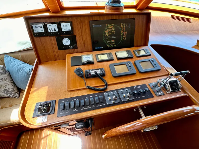 Slide: The Image of Control panel of a 2005 Marlow Explorer 78 yacht with navigation instruments. - 14