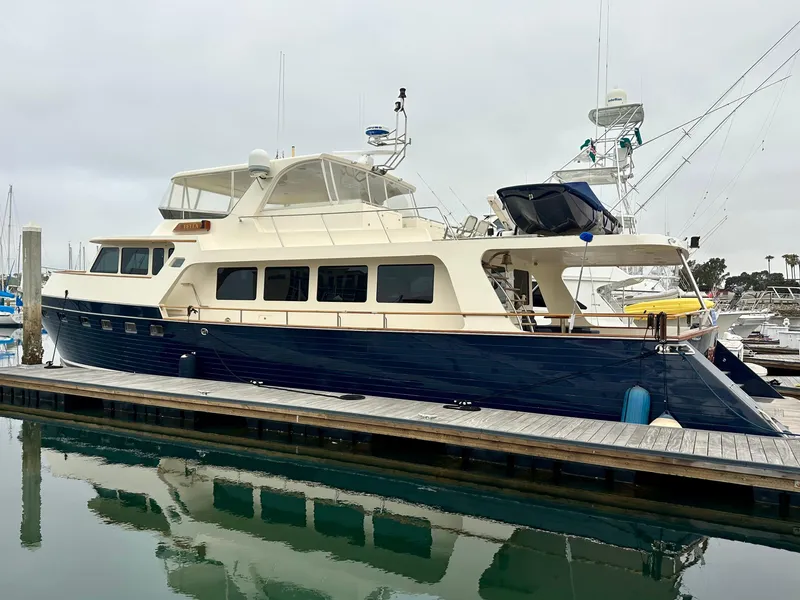 Slide: The Image of 2005 Marlow Explorer 78 yacht docked at marina, side view. - 2