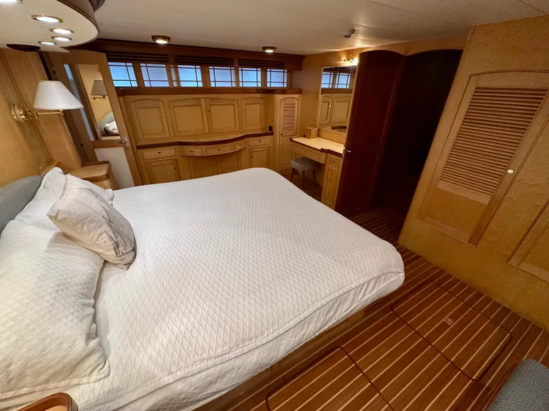 Slide: The Image of Luxurious bedroom interior of 2005 Marlow Explorer 78 yacht with wooden furnishings. - 22