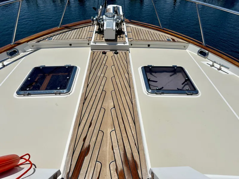 Slide: The Image of Deck view of 2005 Marlow Explorer 78 yacht with teak flooring and hatch windows. - 35