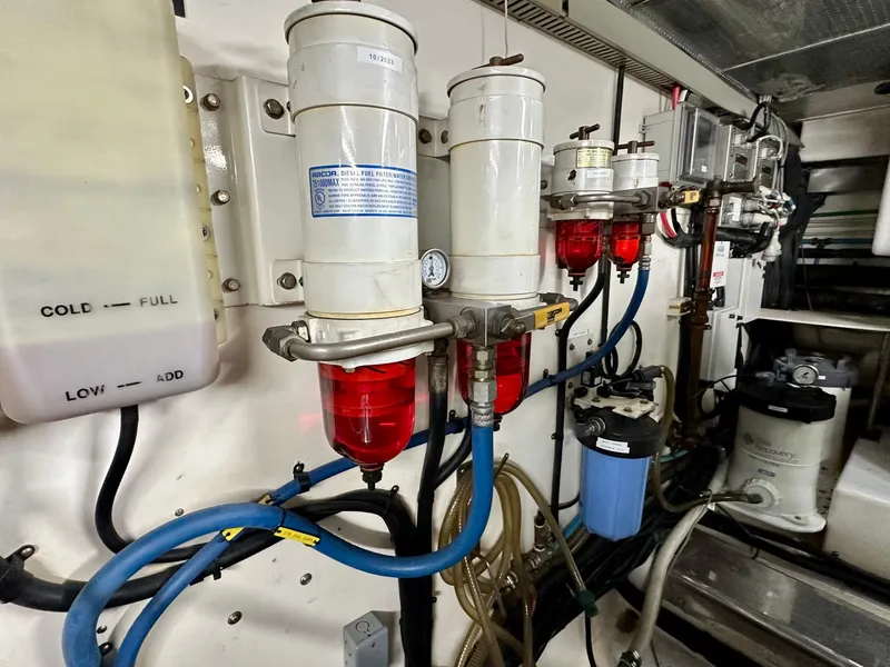 Slide: The Image of Engine room of 2005 Marlow Explorer 78 with fuel filters and hoses. - 41