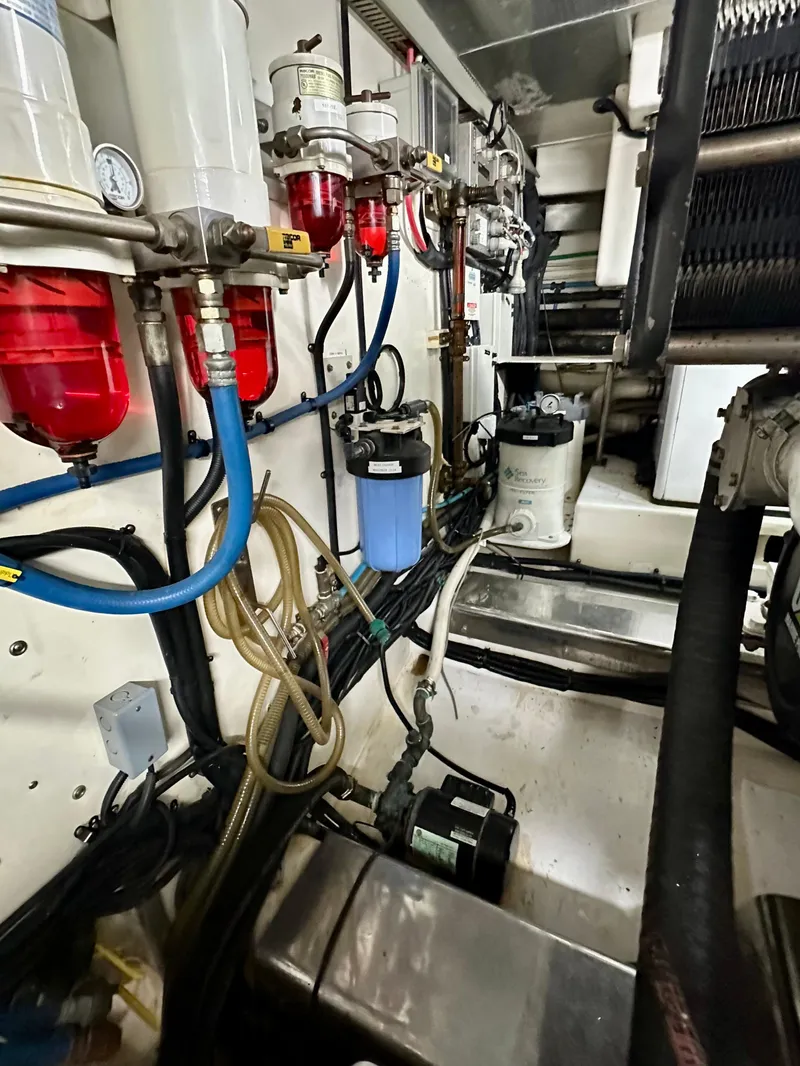 Slide: The Image of Engine room of 2005 Marlow Explorer 78 with fuel filters and hoses. - 43