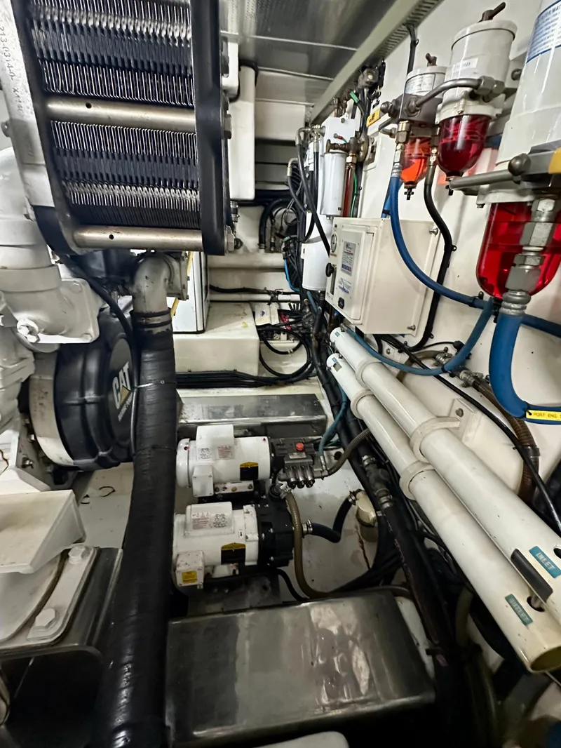 Slide: The Image of Engine room of 2005 Marlow Explorer 78 yacht with visible machinery and piping. - 44