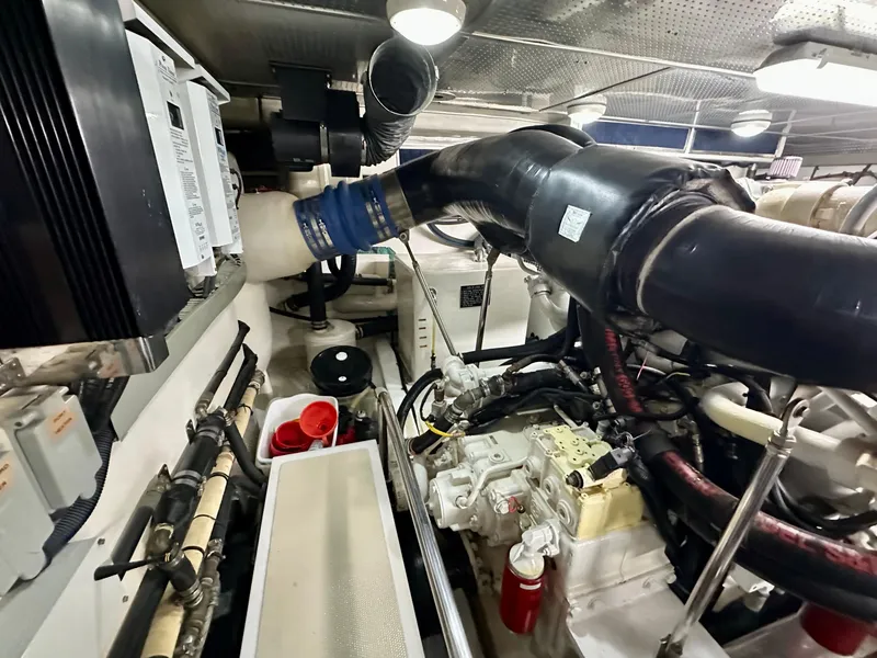 Slide: The Image of Engine room of 2005 Marlow Explorer 78 yacht, featuring complex machinery and piping. - 45
