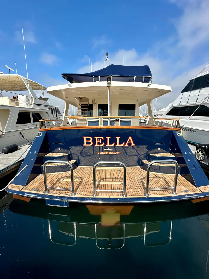 Slide: The Image of 2005 Marlow Explorer 78 yacht "Bella" docked at marina, rear view. - 5