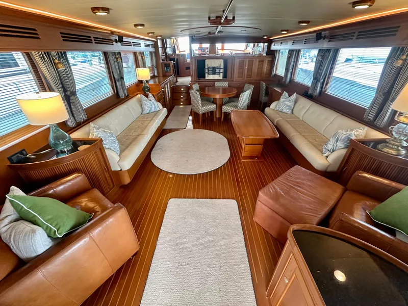 Slide: The Image of Luxurious interior of 2005 Marlow Explorer 78 yacht with elegant seating and wooden flooring. - 6