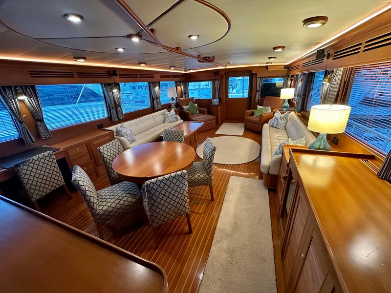 Slide: The Image of Luxurious interior of 2005 Marlow Explorer 78 yacht with elegant seating and dining area. - 7