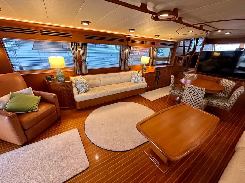 Slide: The Image of Luxurious interior of 2005 Marlow Explorer 78 yacht with elegant seating and wooden finishes. - 8