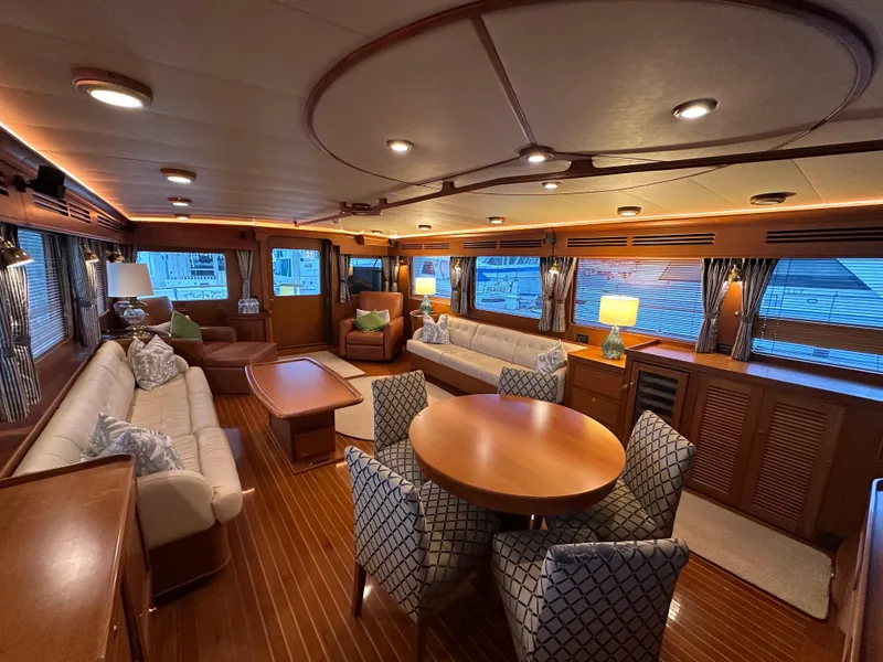 Slide: The Image of Luxurious interior of 2005 Marlow Explorer 78 yacht with elegant seating and dining area. - 9