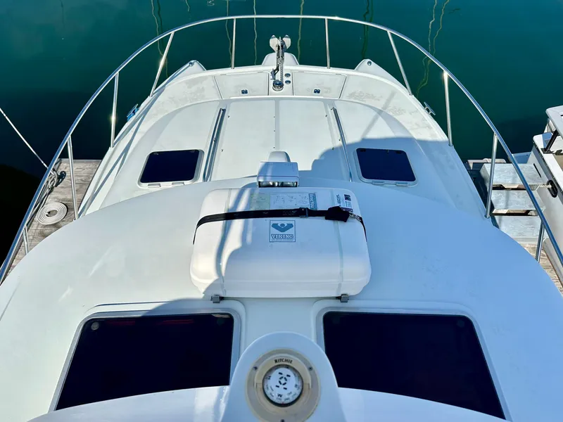 Slide: The Image of 2006 Glacier Bay 3480 Ocean Runner boat deck with safety equipment, docked at marina. - 14