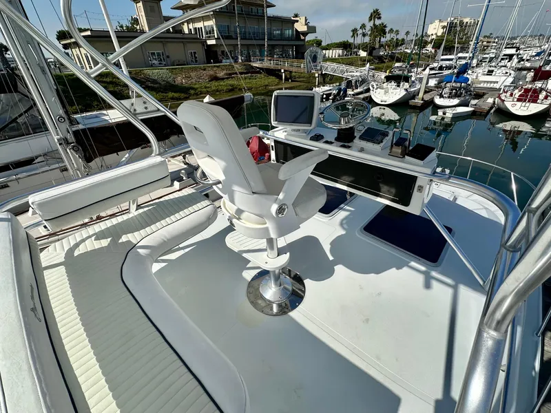 Slide: The Image of 2006 Glacier Bay 3480 Ocean Runner boat helm with marina view, featuring navigation equipment. - 16