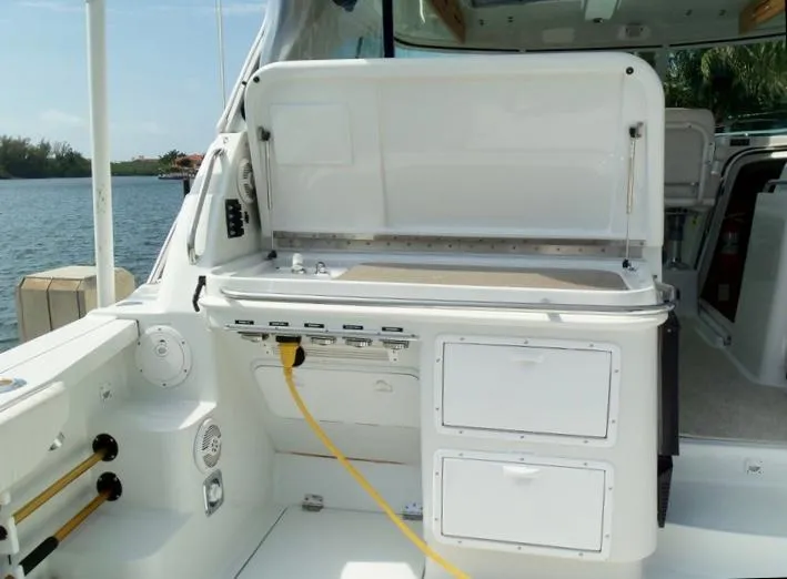 Slide: The Image of 2006 Glacier Bay 3480 Ocean Runner boat interior with storage compartments and water view. - 20