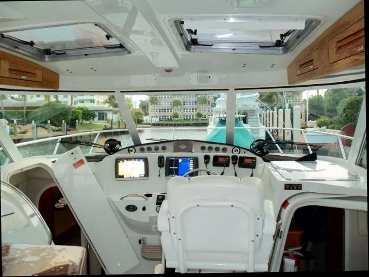 Slide: The Image of Interior view of 2006 Glacier Bay 3480 Ocean Runner boat cockpit with navigation equipment. - 21