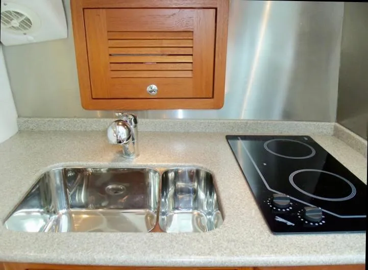 Slide: The Image of 2006 Glacier Bay 3480 Ocean Runner kitchen with sink and stovetop. - 27