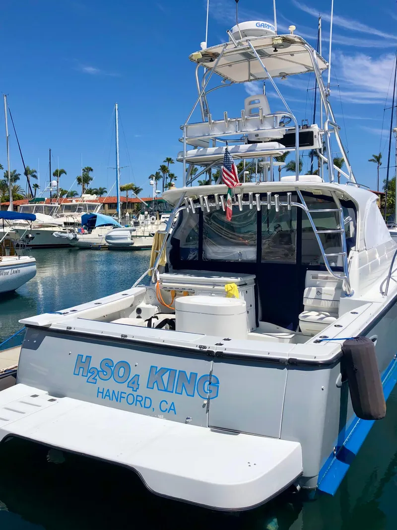 Slide: The Image of 2006 Glacier Bay 3480 Ocean Runner boat docked in sunny marina. - 3