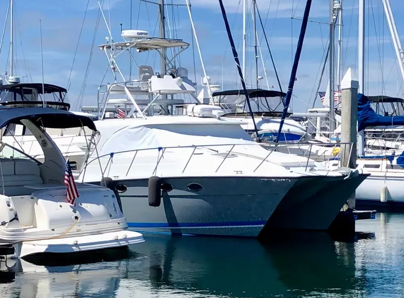 Slide: The Image of 2006 Glacier Bay 3480 Ocean Runner docked in a marina, surrounded by other boats. - 4