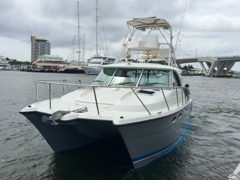 Slide: The Image of 2006 Glacier Bay 3480 Ocean Runner boat docked in marina, overcast sky. - 5