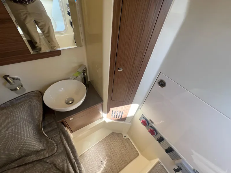 Slide: The Image of 2024 Chris-Craft Catalina 30 interior cabin with sink and storage. - 18