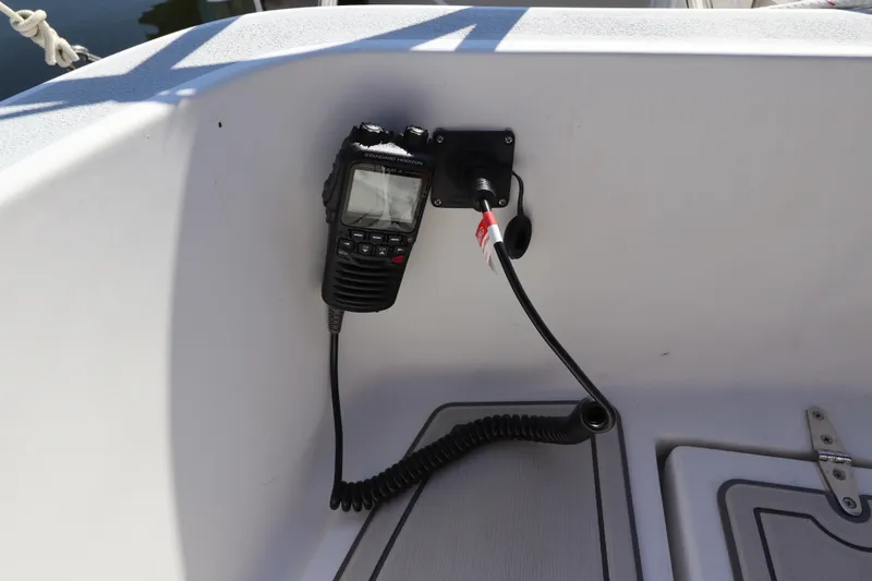 Slide: The Image of VHF radio mounted on a 1995 Nonsuch 260 sailboat cockpit. - 17