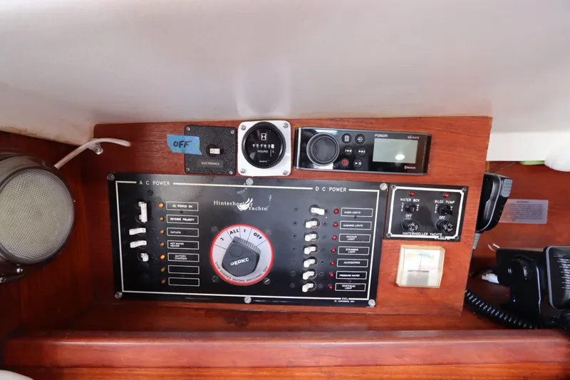 Slide: The Image of Control panel of a 1995 Nonsuch 260 yacht with various switches and gauges. - 28