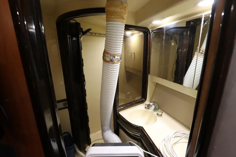 Slide: The Image of Bathroom in 1991 Spectrum 48 Convertible with shower and ventilation hose. - 38
