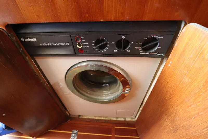 Slide: The Image of Indesit automatic washer/dryer in 1991 Spectrum 48 Convertible yacht interior. - 40