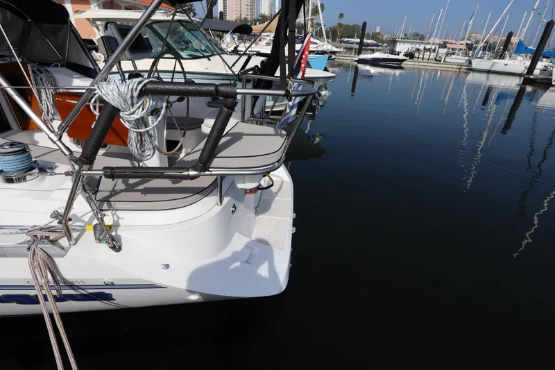 Slide: The Image of Catalina 355 sailboat docked at marina, reflecting on calm water, 2011 model. - 11