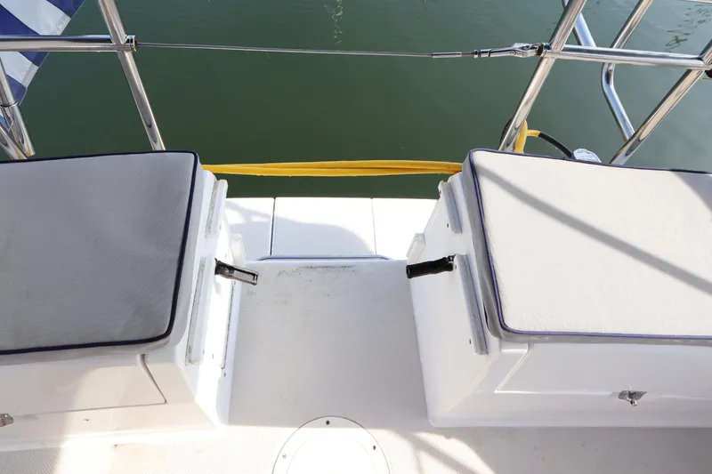 Slide: The Image of Stern view of 2011 Catalina 355 sailboat with cushioned seating and railing. - 12
