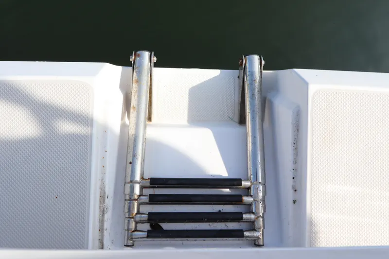 Slide: The Image of Stainless steel boat ladder on 2011 Catalina 355 yacht, extending into water. - 14