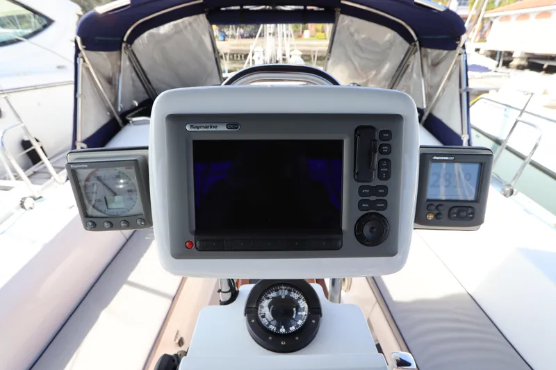 Slide: The Image of Cockpit of 2011 Catalina 355 sailboat with Raymarine navigation equipment and compass. - 17