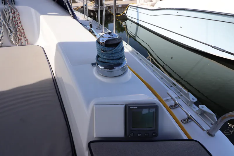 Slide: The Image of 2011 Catalina 355 sailboat deck with winch and navigation display. - 19