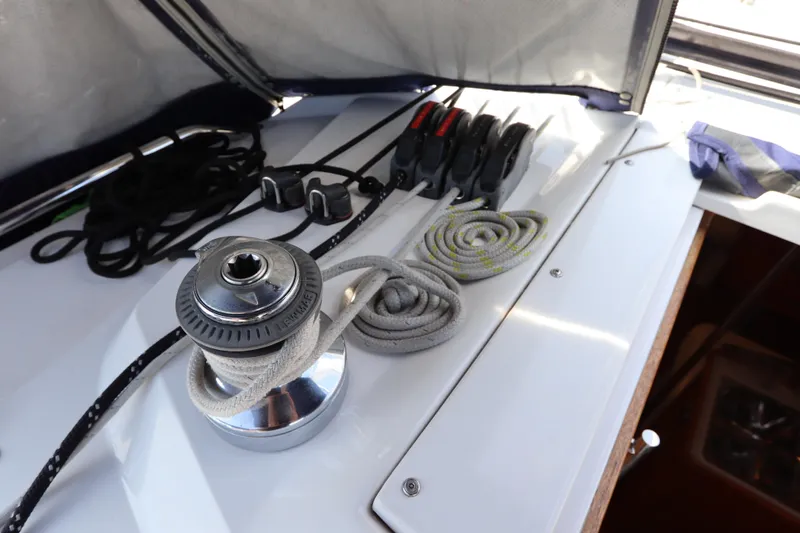 Slide: The Image of Sailing equipment on a 2011 Catalina 355 yacht, featuring winch and ropes. - 23