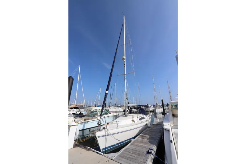Slide: The Image of Sailboat Catalina 355, 2011 model, docked at marina under clear blue sky. - 3