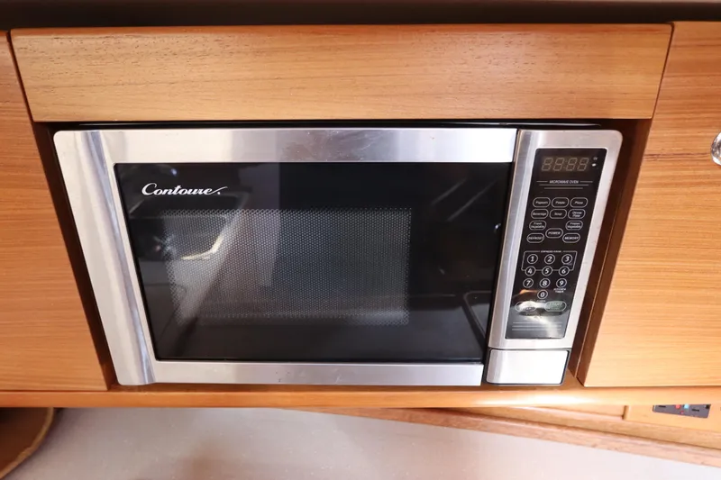 Slide: The Image of Built-in Contoure microwave in 2011 Catalina 355 yacht kitchen. - 32