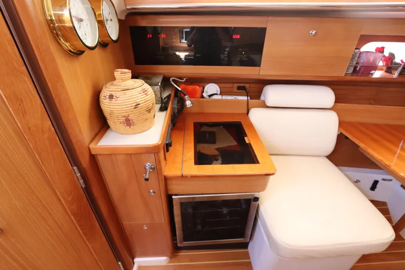 Slide: The Image of Cozy interior of 2011 Catalina 355 yacht with wooden cabinetry and comfortable seating. - 35