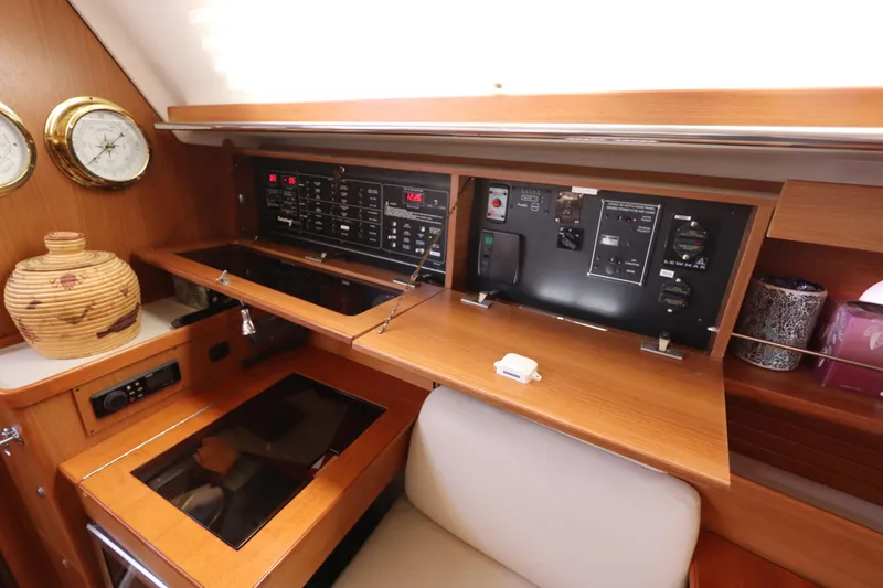 Slide: The Image of 2011 Catalina 355 yacht interior with control panel and wooden cabinetry. - 36