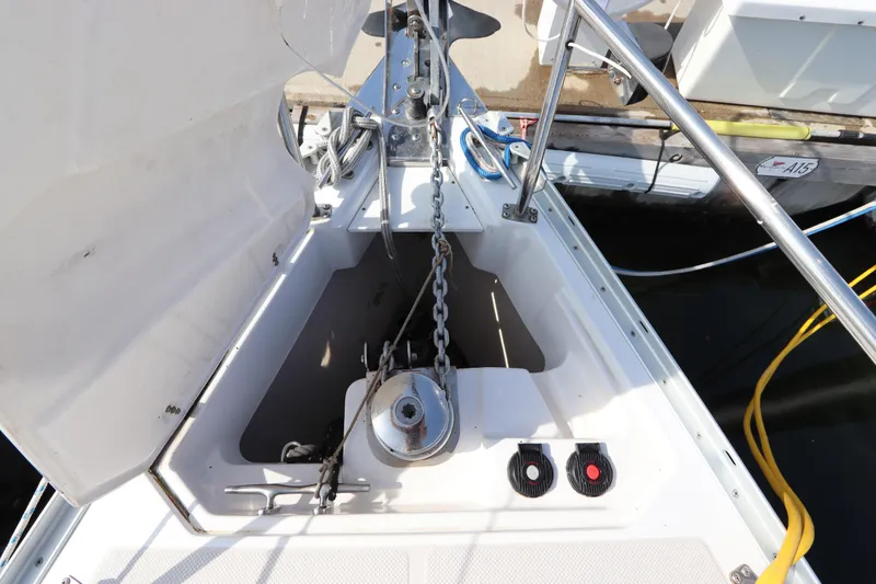 Slide: The Image of Anchor locker of a 2011 Catalina 355 sailboat with visible chain and winch. - 5
