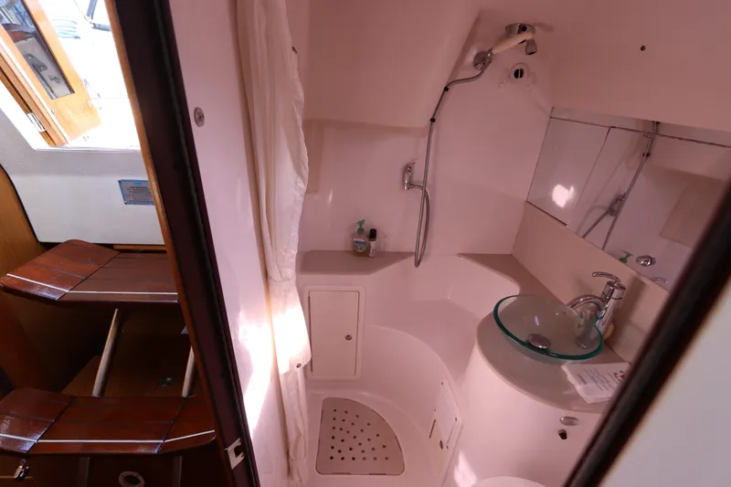 Slide: The Image of Bathroom interior of 2011 Catalina 355 sailboat with shower and glass sink. - 52