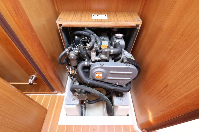 Slide: The Image of Engine compartment of a 2011 Catalina 355 sailboat, showcasing mechanical components. - 55