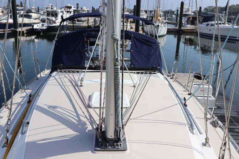 Slide: The Image of Sailboat Catalina 355, 2011 model, docked at marina with visible rigging and deck. - 8