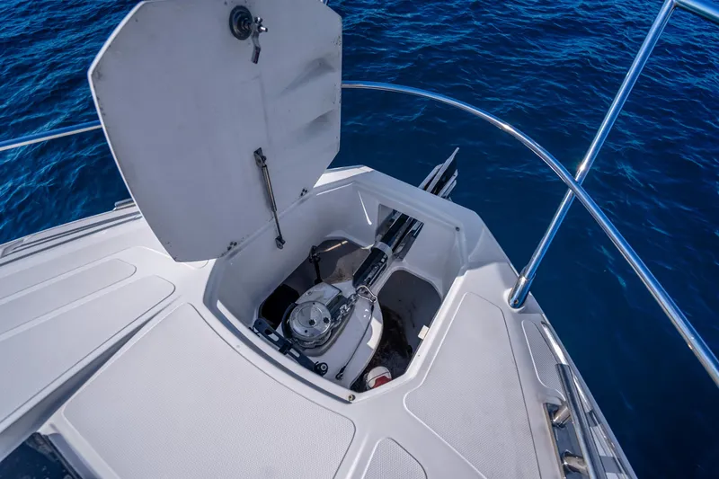 Slide: The Image of Open anchor compartment on 2021 Azimut Atlantis 51 yacht, with ocean backdrop. - 13