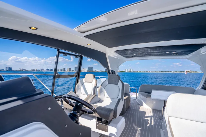 Slide: The Image of Luxurious 2021 Azimut Atlantis 51 yacht interior with ocean view and modern seating. - 27