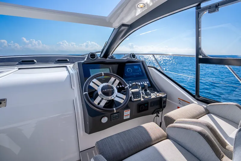 Slide: The Image of Helm of 2021 Azimut Atlantis 51 yacht with ocean view. - 32
