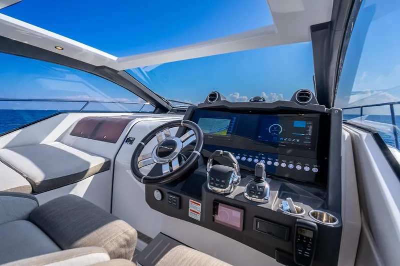 Slide: The Image of Cockpit of 2021 Azimut Atlantis 51 yacht with modern navigation controls and ocean view. - 34