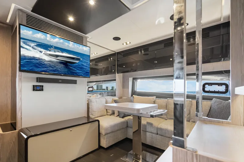 Slide: The Image of Luxurious interior of 2021 Azimut Atlantis 51 yacht with modern furnishings and large TV. - 66