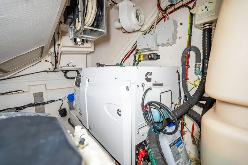 Slide: The Image of Engine room of 2021 Azimut Atlantis 51 yacht with Cummins generator and wiring. - 80